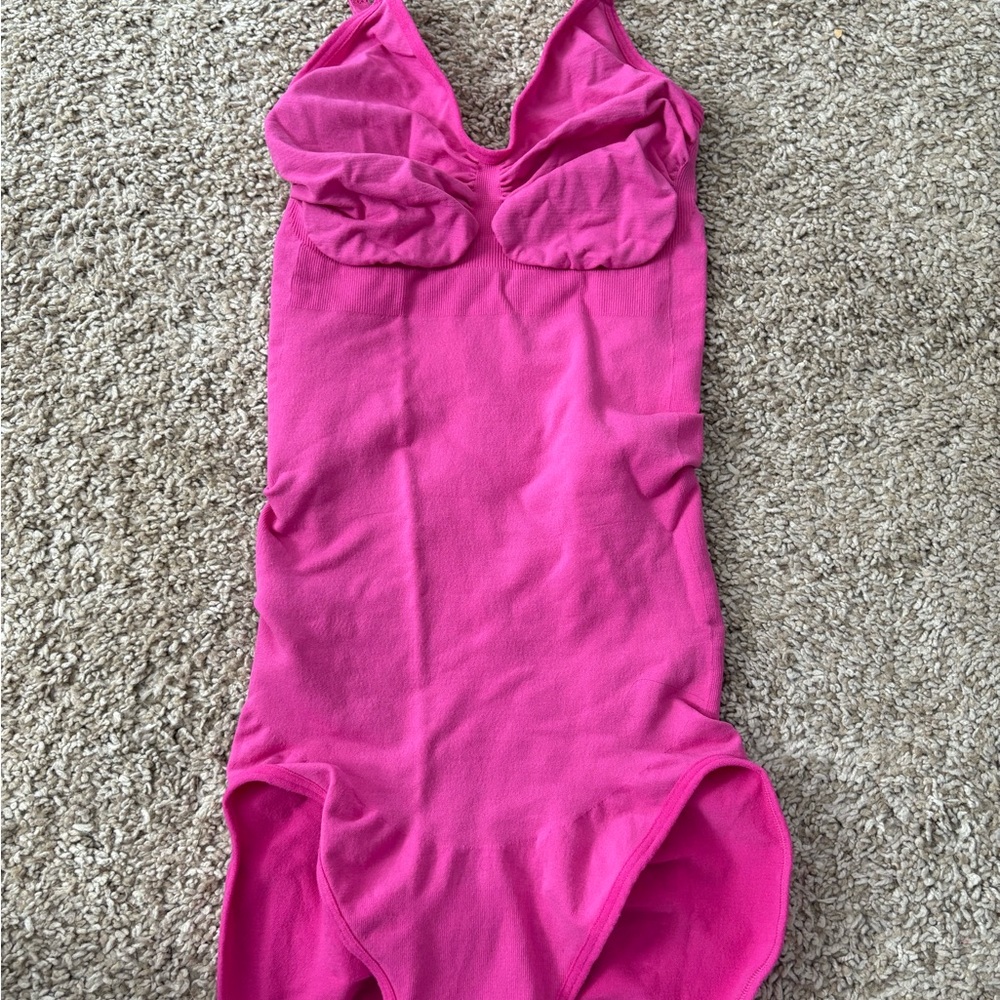 Vibrant Pink Bodysuit with V-Neck and Smooth Fit